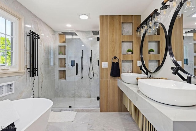 21262 S Woodland Rd, Shaker Heights, OH 44122 - full bath featuring tile walls, a marble finish shower, a freestanding bath, and double vanity