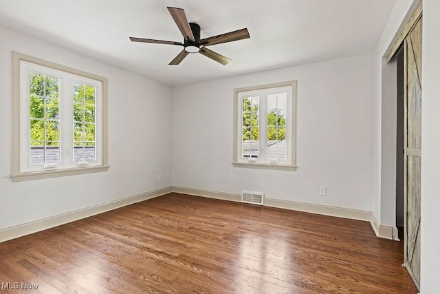 21262 S Woodland Rd, Shaker Heights, OH 44122 - unfurnished room featuring plenty of natural light, wood finished floors, a ceiling fan, and baseboards