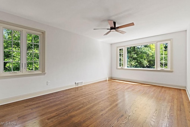 21262 S Woodland Rd, Shaker Heights, OH 44122 - unfurnished room featuring ceiling fan, wood finished floors, and baseboards