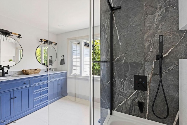 21262 S Woodland Rd, Shaker Heights, OH 44122 - full bath with double vanity, a marble finish shower, and tile patterned flooring