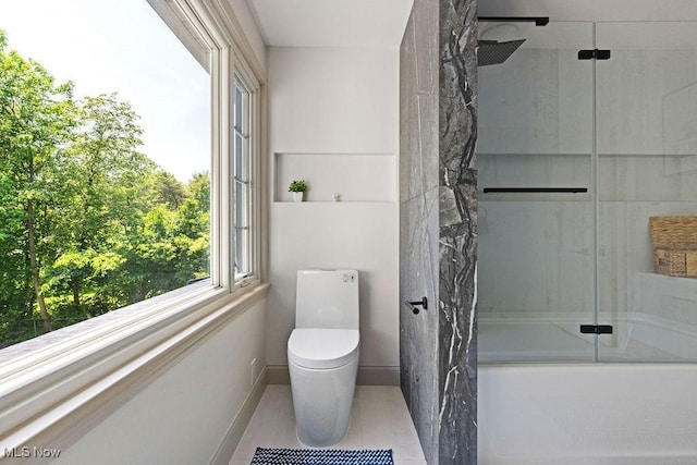 21262 S Woodland Rd, Shaker Heights, OH 44122 - full bath featuring combined bath / shower with glass door, toilet, tile patterned flooring, and baseboards