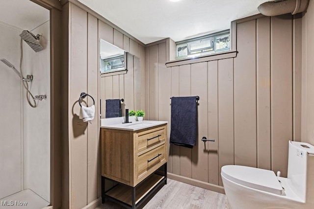 21262 S Woodland Rd, Shaker Heights, OH 44122 - full bath featuring toilet, vanity, a shower, and wood finished floors