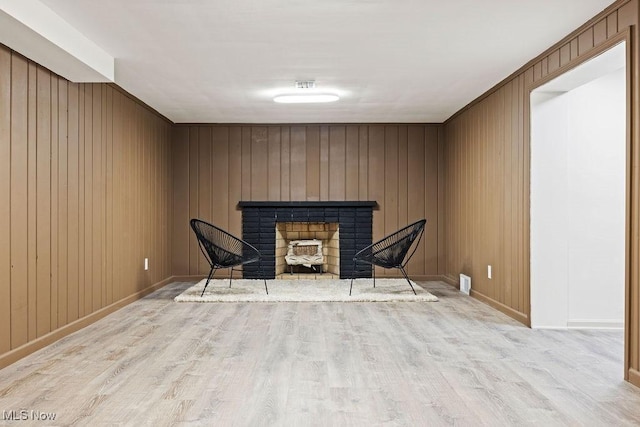 21262 S Woodland Rd, Shaker Heights, OH 44122 - sitting room with wood finished floors, a fireplace, baseboards, and wood walls