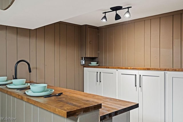 21262 S Woodland Rd, Shaker Heights, OH 44122 - kitchen with butcher block countertops and white cabinetry