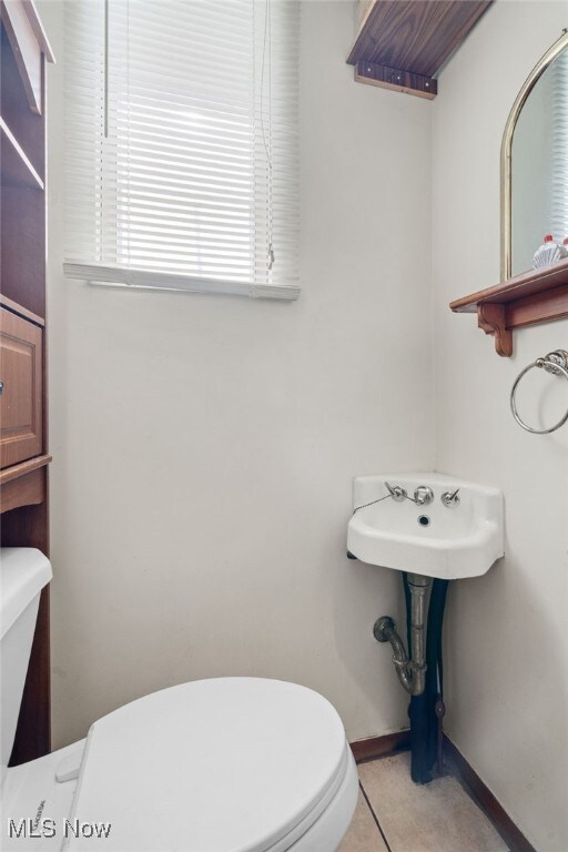 6123 Wilson Mills Rd, Highland Heights, OH 44143 - bathroom with toilet and baseboards