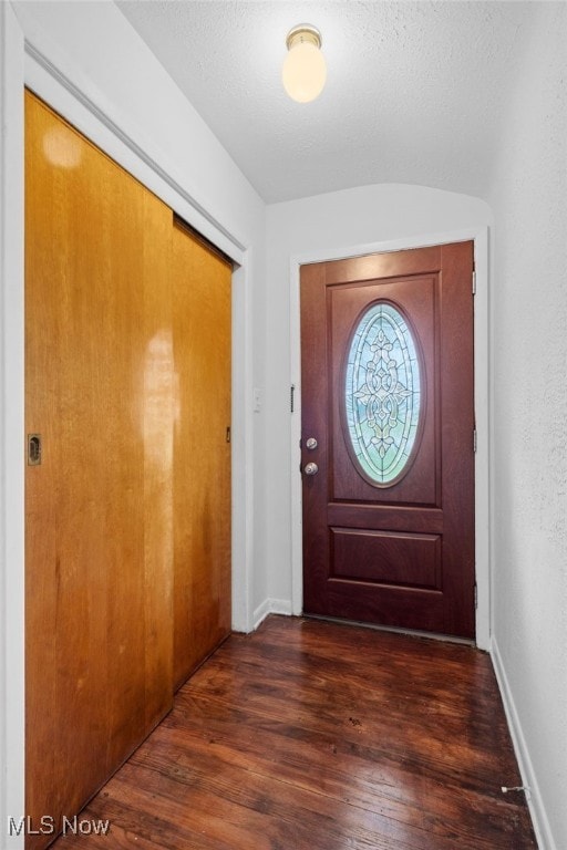 6123 Wilson Mills Rd, Highland Heights, OH 44143 - foyer entrance featuring dark wood finished floors and baseboards