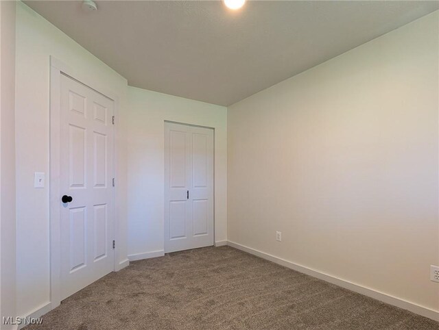 3509 Jerrold Blvd, Brunswick, OH 44212 - unfurnished bedroom with carpet flooring, baseboards, and a closet