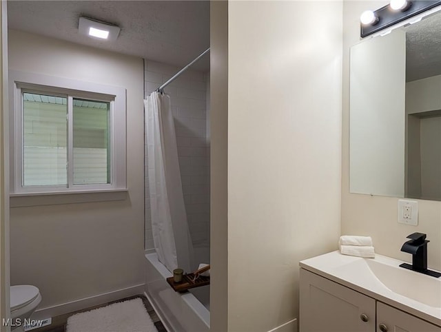 3509 Jerrold Blvd, Brunswick, OH 44212 - bathroom with vanity, baseboards, toilet, shower / tub combo, and a textured ceiling