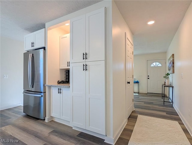 3509 Jerrold Blvd, Brunswick, OH 44212 - kitchen featuring freestanding refrigerator, dark wood finished floors, white cabinets, baseboards, and recessed lighting