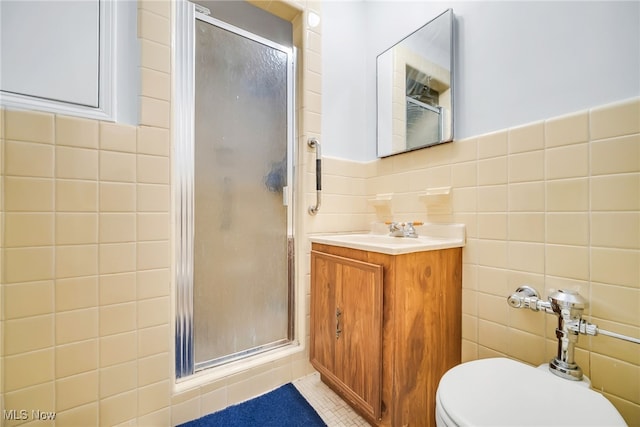 13800 Fairhill Rd Unit 418, Shaker Heights, OH 44120 - full bathroom featuring tile walls, a stall shower, vanity, toilet, and tile patterned floors