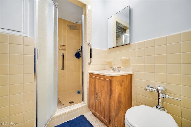13800 Fairhill Rd Unit 418, Shaker Heights, OH 44120 - bathroom with tile walls, a stall shower, vanity, tile patterned floors, and toilet