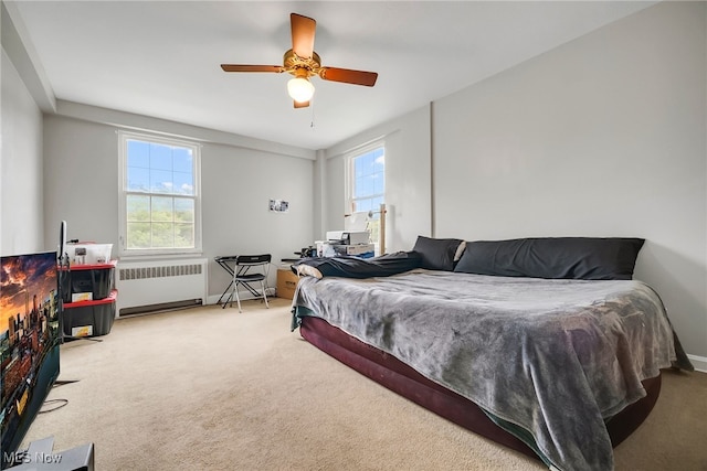 13800 Fairhill Rd Unit 418, Shaker Heights, OH 44120 - bedroom featuring radiator, carpet flooring, baseboards, and ceiling fan