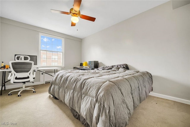 13800 Fairhill Rd Unit 418, Shaker Heights, OH 44120 - bedroom with light carpet, radiator heating unit, baseboards, and ceiling fan
