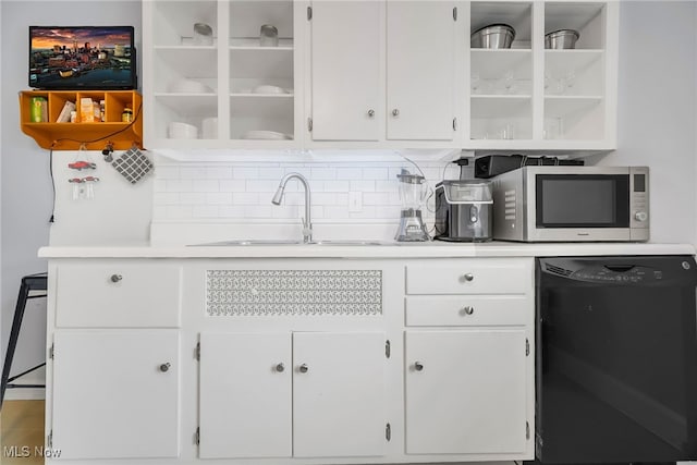 13800 Fairhill Rd Unit 418, Shaker Heights, OH 44120 - kitchen with black dishwasher, stainless steel microwave, open shelves, and light countertops