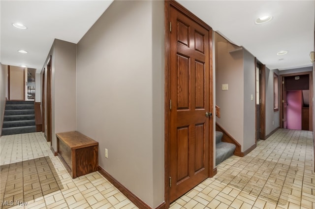 2015 Dunzweiler Dr, Zanesville, OH 43701 - hall with stairway, baseboards, brick patterned flooring, and recessed lighting