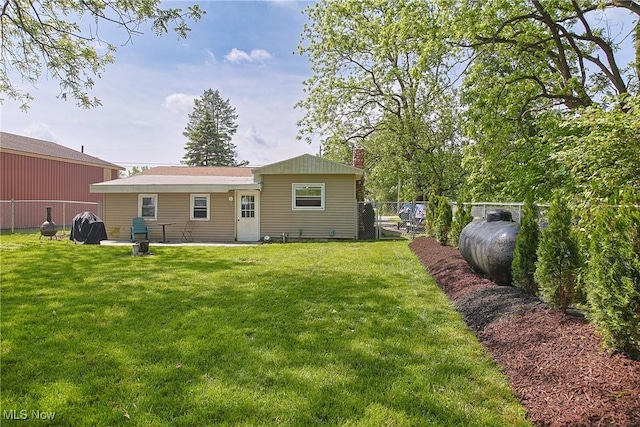 3407 State Route 113 E, Milan, OH 44846 - rear view of property featuring a chimney