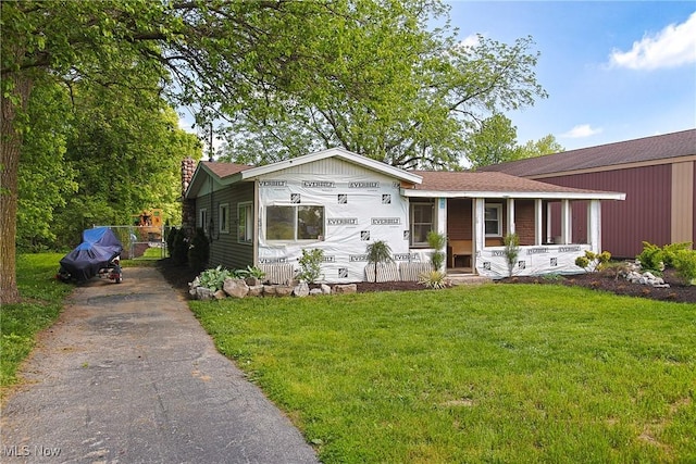 3407 State Route 113 E, Milan, OH 44846 - view of front facade featuring a front yard, asphalt driveway, and covered porch