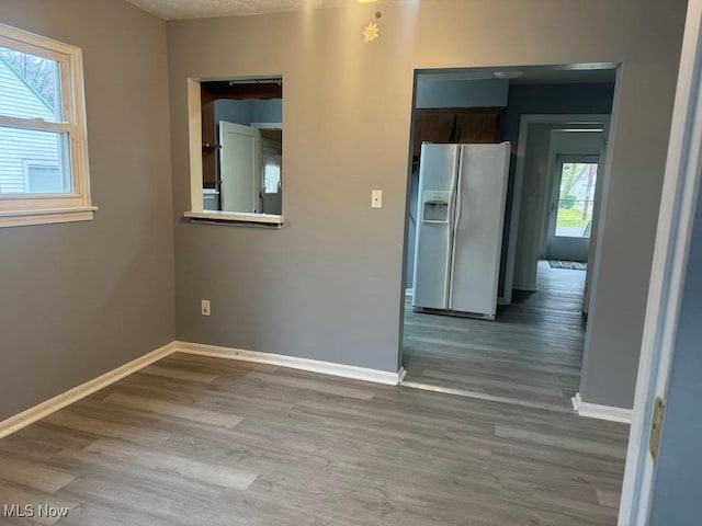 1090 Hartford Ave, Akron, OH 44320 - unfurnished room with baseboards and wood finished floors