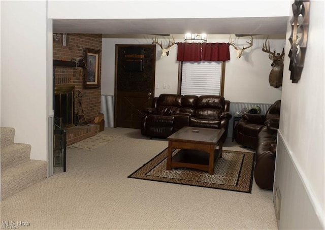 646 Ridgewood Dr, Coshocton, OH 43812 - living room with carpet floors, a fireplace, and stairway