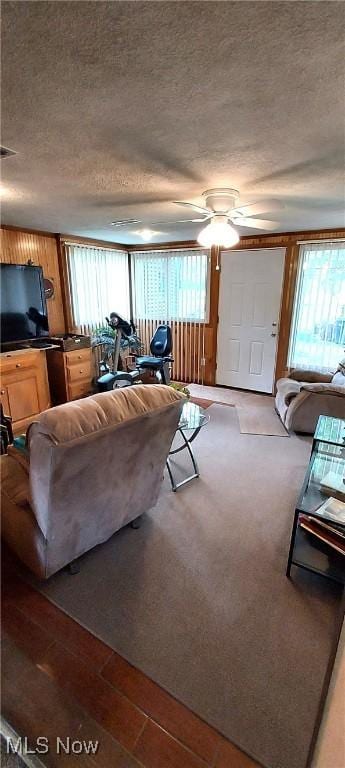 550 E Pleasant Valley Rd, Seven Hills, OH 44131 - living room featuring a textured ceiling, ceiling fan, and wood finished floors