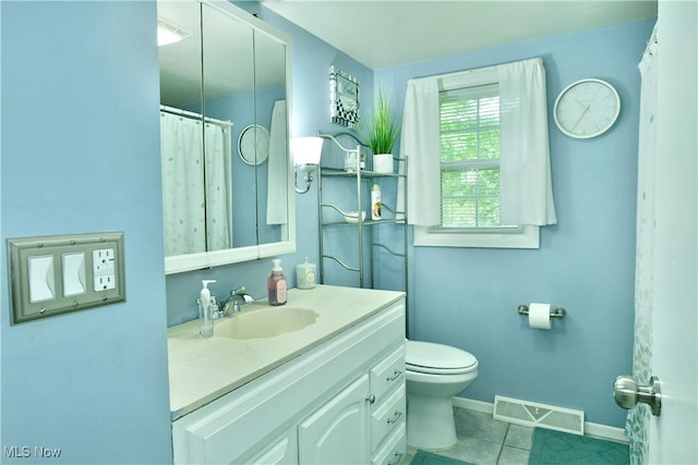377 Henn Hyde Rd NE, Warren, OH 44484 - bathroom with vanity, toilet, tile patterned flooring, and baseboards