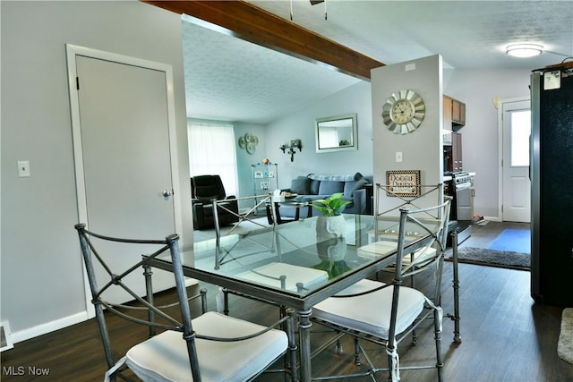 377 Henn Hyde Rd NE, Warren, OH 44484 - dining space with baseboards, wood finished floors, and a textured ceiling