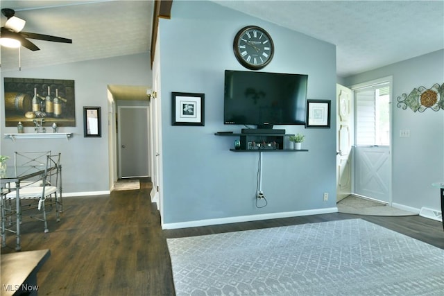 377 Henn Hyde Rd NE, Warren, OH 44484 - living room featuring wood finished floors, baseboards, a ceiling fan, and vaulted ceiling