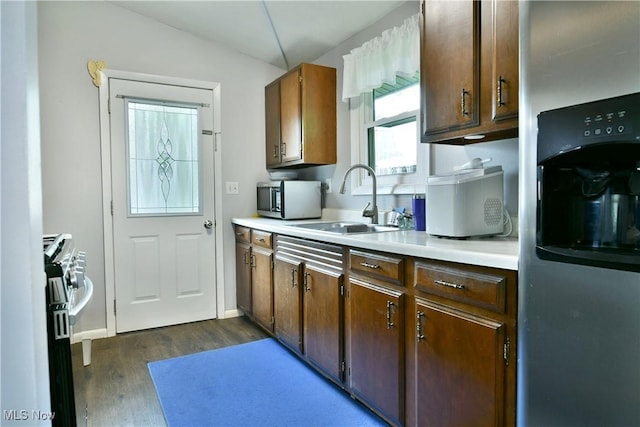 377 Henn Hyde Rd NE, Warren, OH 44484 - kitchen with a sink, appliances with stainless steel finishes, dark wood-style flooring, and light countertops