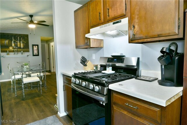 377 Henn Hyde Rd NE, Warren, OH 44484 - kitchen with gas stove, under cabinet range hood, dark wood-type flooring, ceiling fan, and brown cabinets