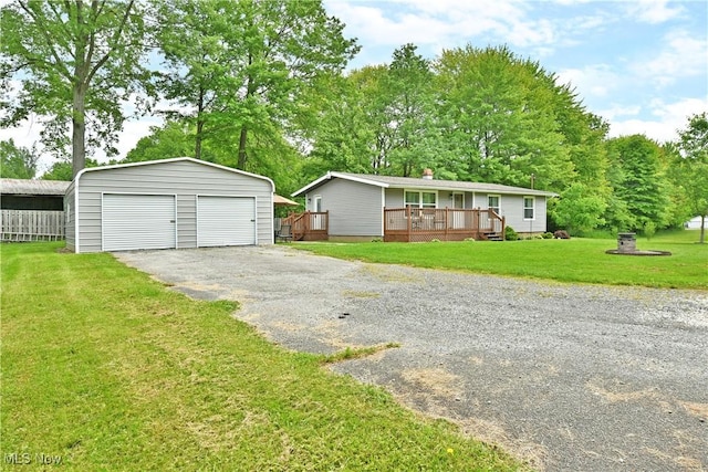 377 Henn Hyde Rd NE, Warren, OH 44484 - view of front facade with an outdoor structure, a garage, a wooden deck, and a front yard