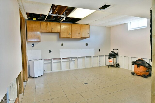 377 Henn Hyde Rd NE, Warren, OH 44484 - kitchen featuring light tile patterned floors and brown cabinetry