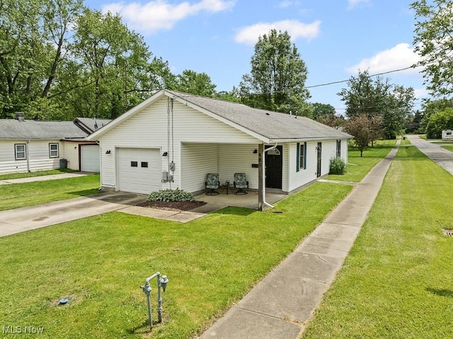489 W Georgia Ave, Sebring, OH 44672 - view of front of home with a front yard, driveway, an attached garage, and roof with shingles