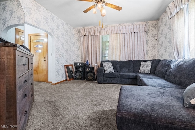 917 Park Ave SW, Canton, OH 44706 - living area with wallpapered walls, carpet, arched walkways, ceiling fan, and baseboards