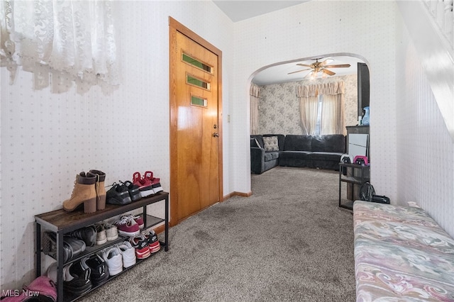 917 Park Ave SW, Canton, OH 44706 - hall with arched walkways, wallpapered walls, and carpet flooring