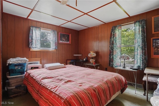 890 E Liberty St, Hubbard, OH 44425 - carpeted bedroom with multiple windows and wooden walls