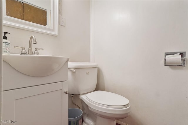 890 E Liberty St, Hubbard, OH 44425 - half bathroom featuring toilet and vanity