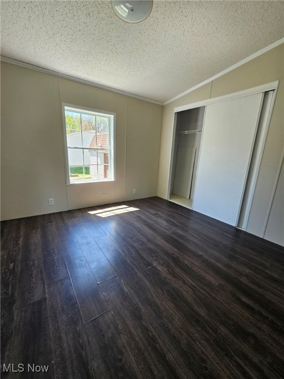 508 Fritsch Ave, Springfield, OH 44312 - unfurnished bedroom featuring a textured ceiling, wood finished floors, crown molding, and a closet
