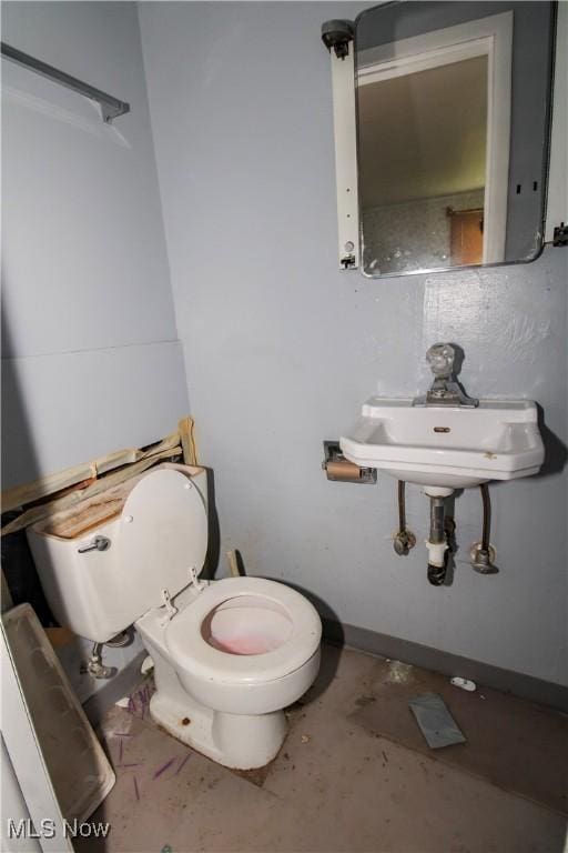 177 Sumner St, Oberlin, OH 44074 - bathroom featuring toilet and concrete floors