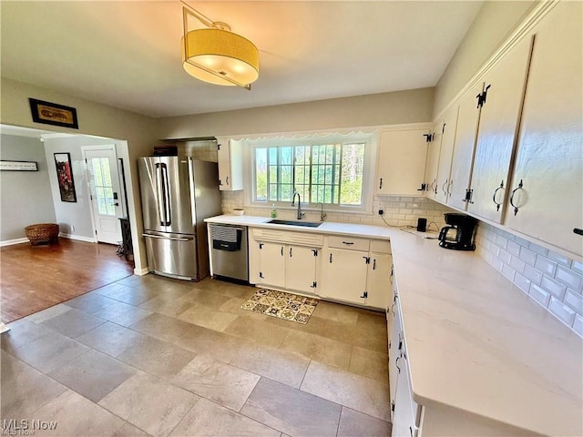 6911 Post Ln, Hudson, OH 44236 - kitchen featuring appliances with stainless steel finishes, a sink, and light countertops