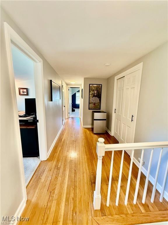 6911 Post Ln, Hudson, OH 44236 - corridor featuring light wood-style flooring and baseboards