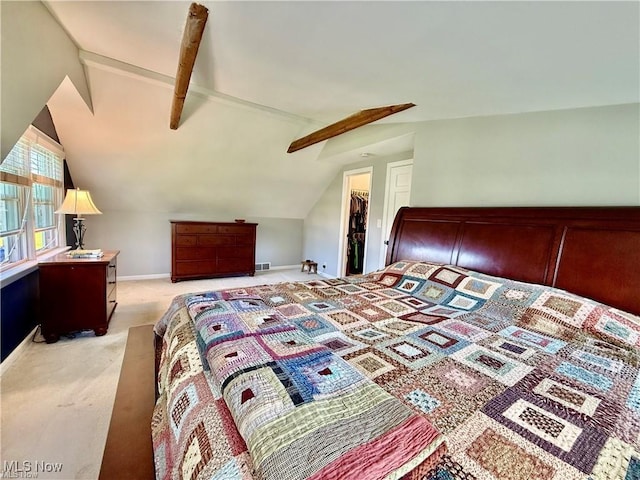 6911 Post Ln, Hudson, OH 44236 - bedroom with lofted ceiling, light carpet, a walk in closet, baseboards, and a closet