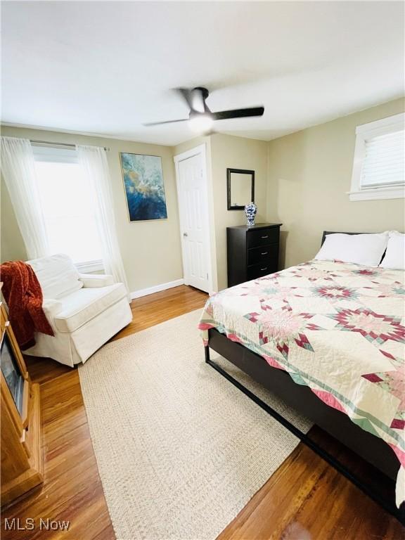 1630 Olivewood Ave, Lakewood, OH 44107 - bedroom featuring light wood-type flooring, ceiling fan, and baseboards