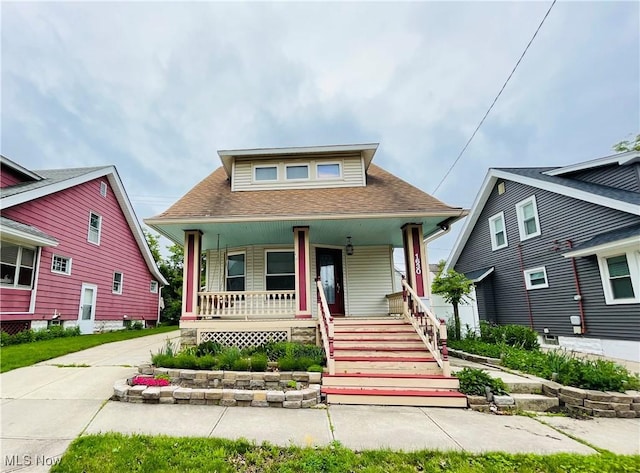 1630 Olivewood Ave, Lakewood, OH 44107 - bungalow-style house with covered porch, roof with shingles, and stairway