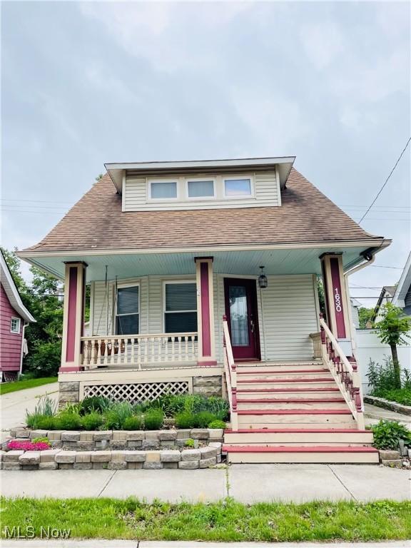 1630 Olivewood Ave, Lakewood, OH 44107 - bungalow-style home with covered porch and roof with shingles