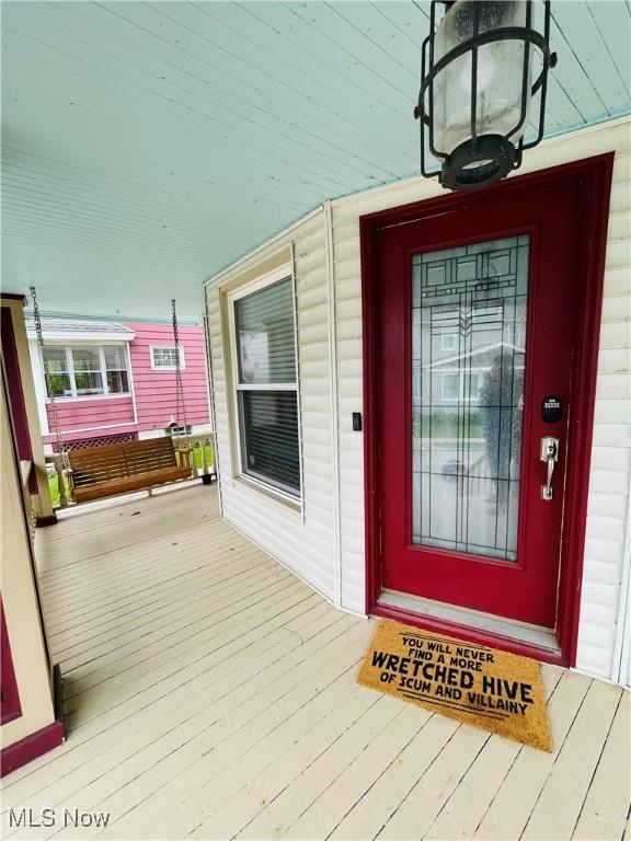 1630 Olivewood Ave, Lakewood, OH 44107 - doorway to property featuring covered porch