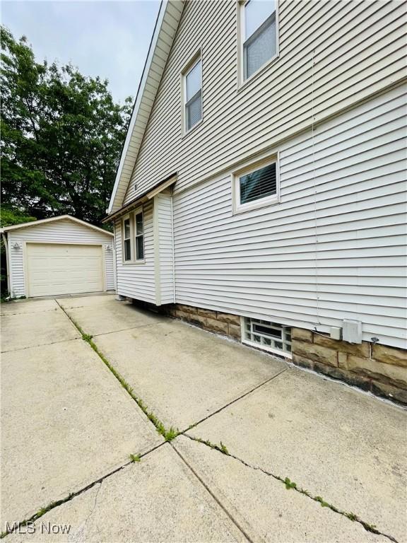 1630 Olivewood Ave, Lakewood, OH 44107 - view of side of property with an outdoor structure and a garage