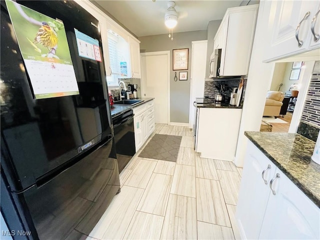 1630 Olivewood Ave, Lakewood, OH 44107 - kitchen featuring freestanding refrigerator, a sink, stove, white cabinets, and stainless steel microwave