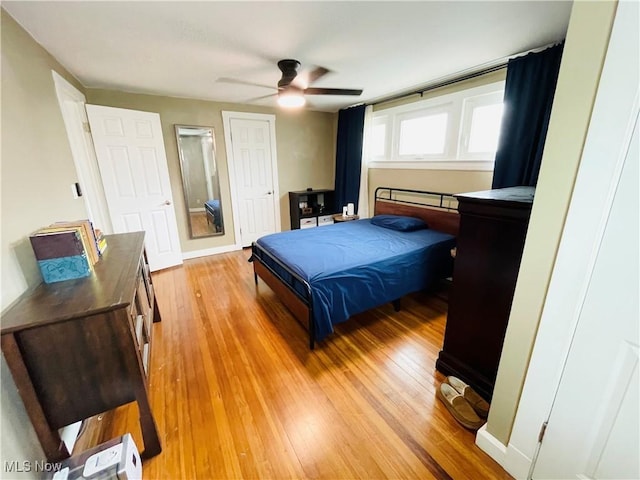 1630 Olivewood Ave, Lakewood, OH 44107 - bedroom with light wood finished floors, ceiling fan, and baseboards
