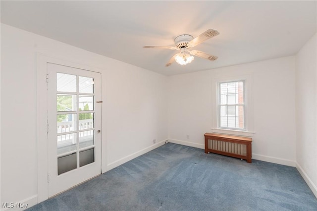 2224 Emily Ave, Lakewood, OH 44107 - carpeted spare room featuring radiator, baseboards, and a ceiling fan