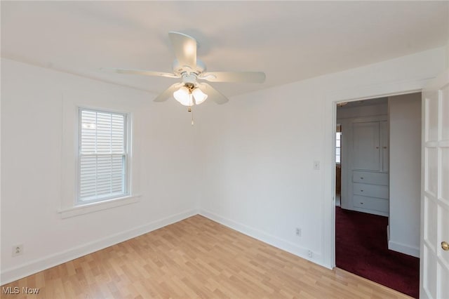 2224 Emily Ave, Lakewood, OH 44107 - spare room with light wood-style floors, a ceiling fan, healthy amount of natural light, and baseboards